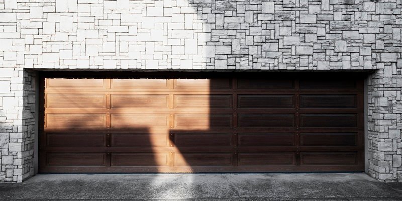 Modern insulated double garage door showcasing residential garage door installation and repair services.