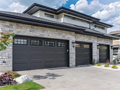 Stunning contemporary home featuring a three-car garage and stunning landscaping